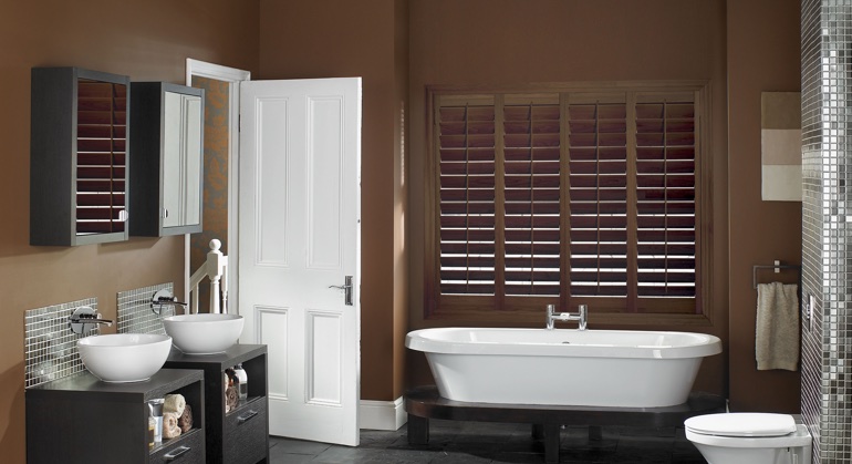 Stained wood shutter in San Diego restroom